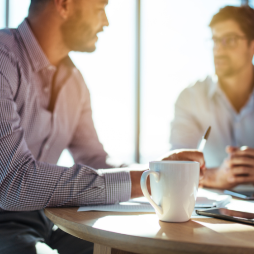 Two men talking about an ambassador program